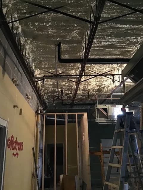 Overhead conduit work in progress under sprayfoam-insulated ceiling