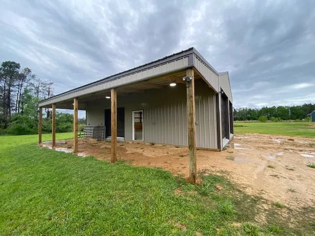 Side angle of the residential shop with covered awning extending the work area outside