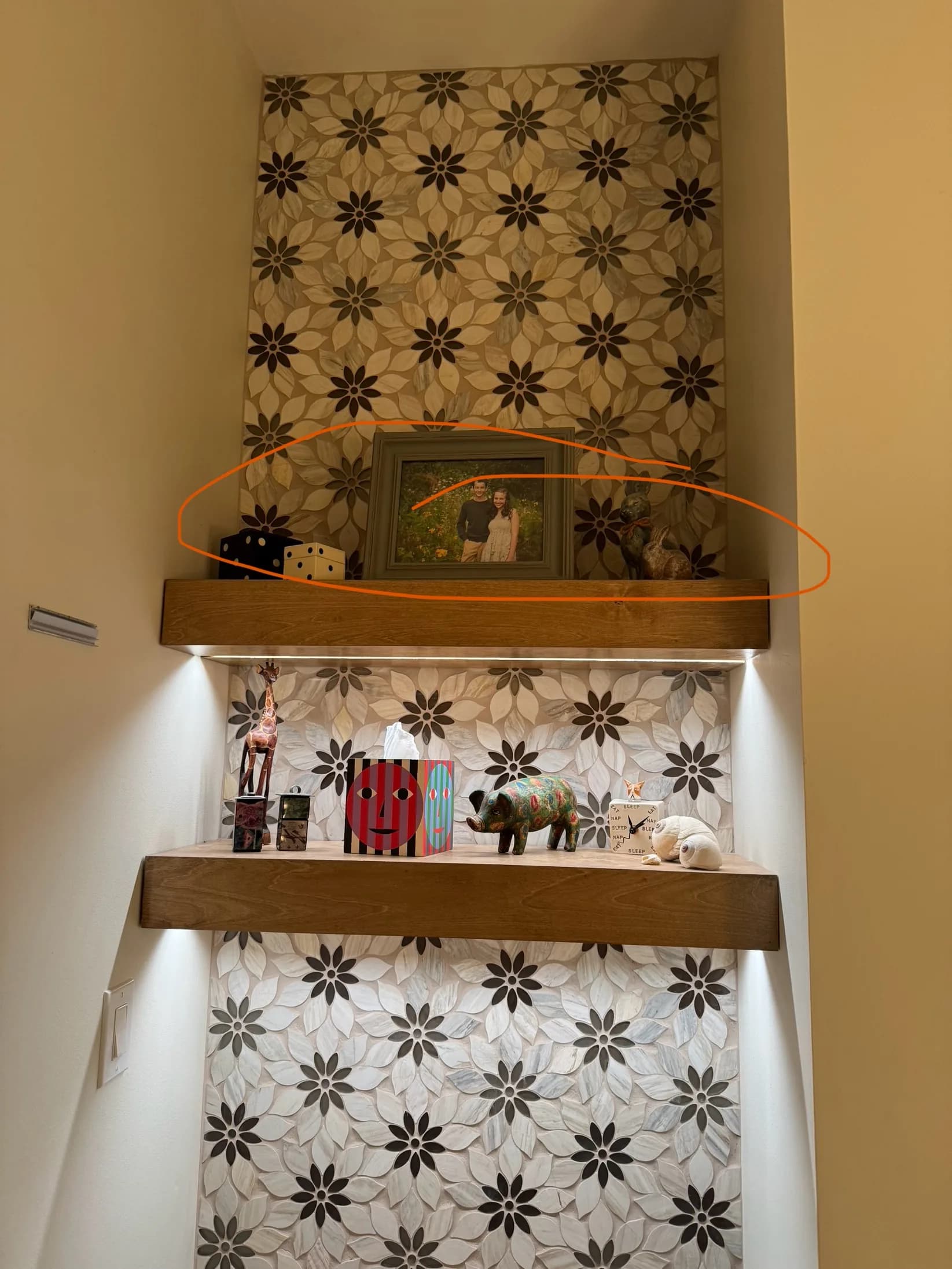 Floating shelves with under-shelf LED accent lighting in a Lake Charles master bath remodel